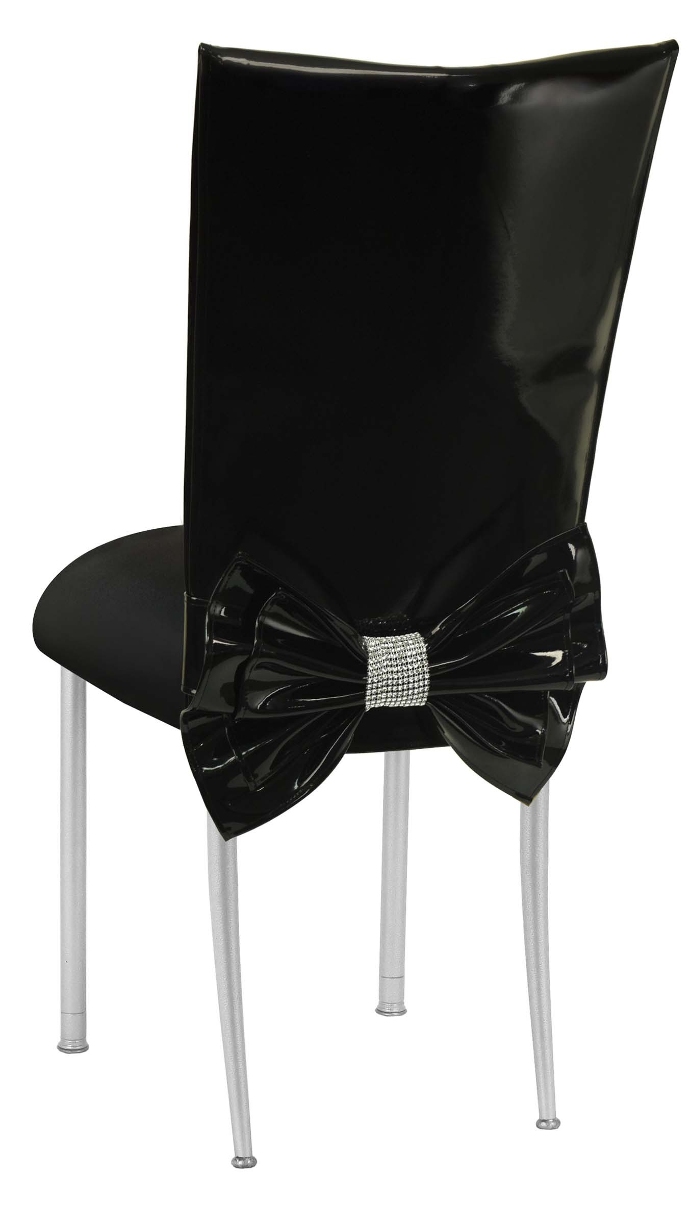 Black Patent Leather Chair Cover with Rhinestone Bow and Black Stretch Knit Cushion on Silver Legs – Chameleon Chair Collection | Rental
